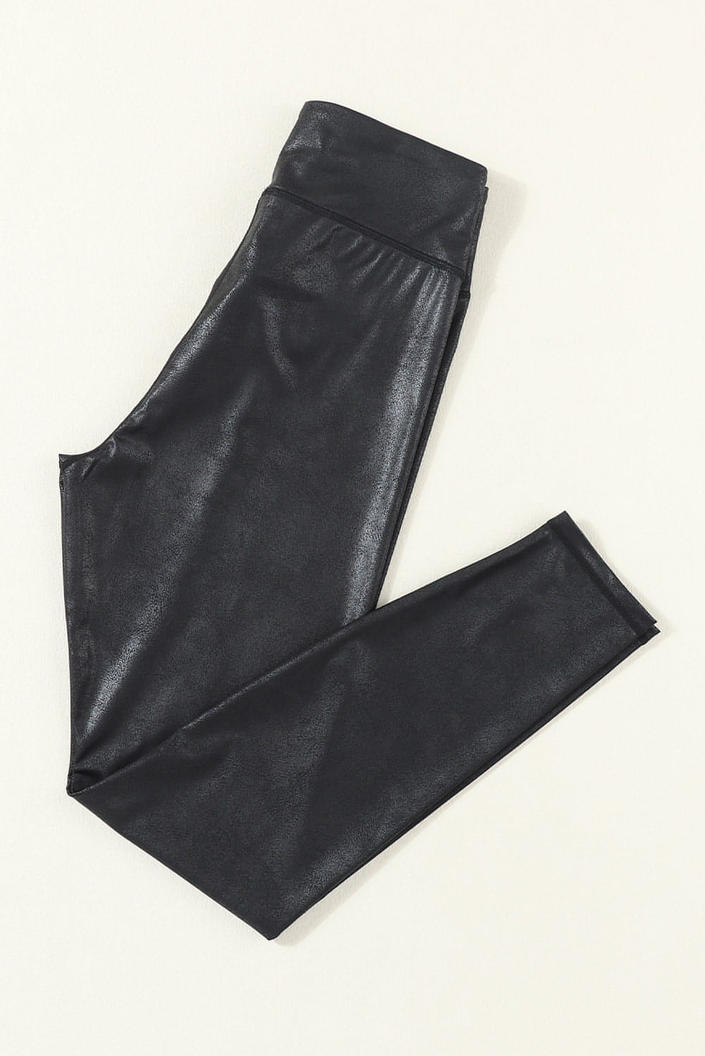 Leggings de cuero elegantes con cintura cruzada en color negro