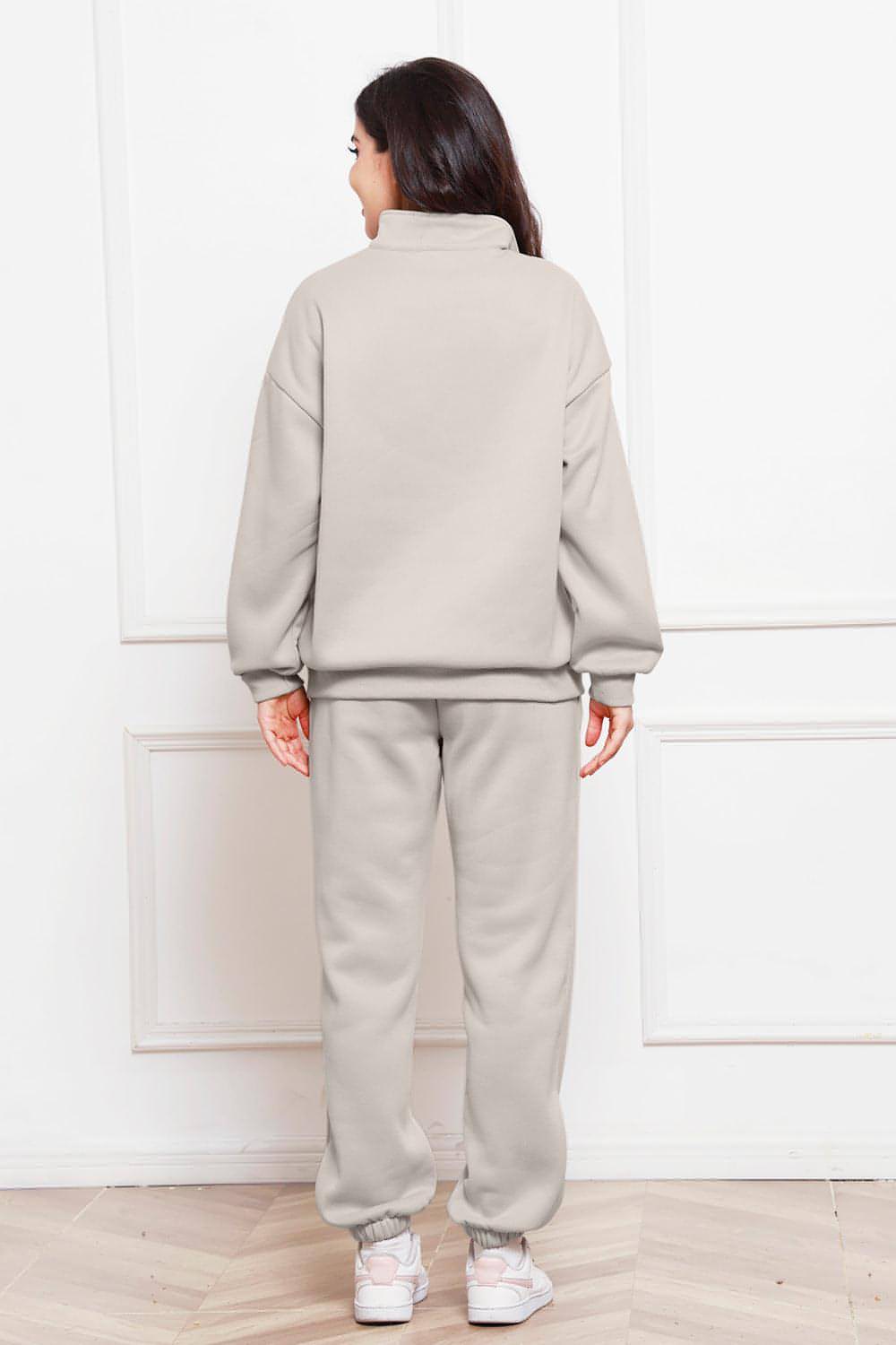 Completo di felpa e pantaloni a maniche lunghe con mezza zip