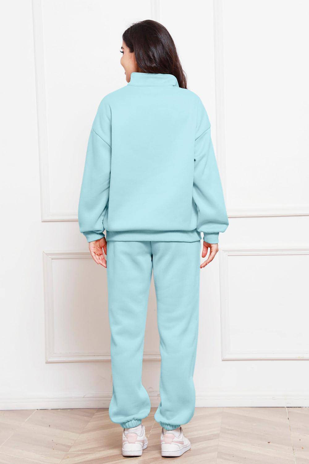 Completo di felpa e pantaloni a maniche lunghe con mezza zip