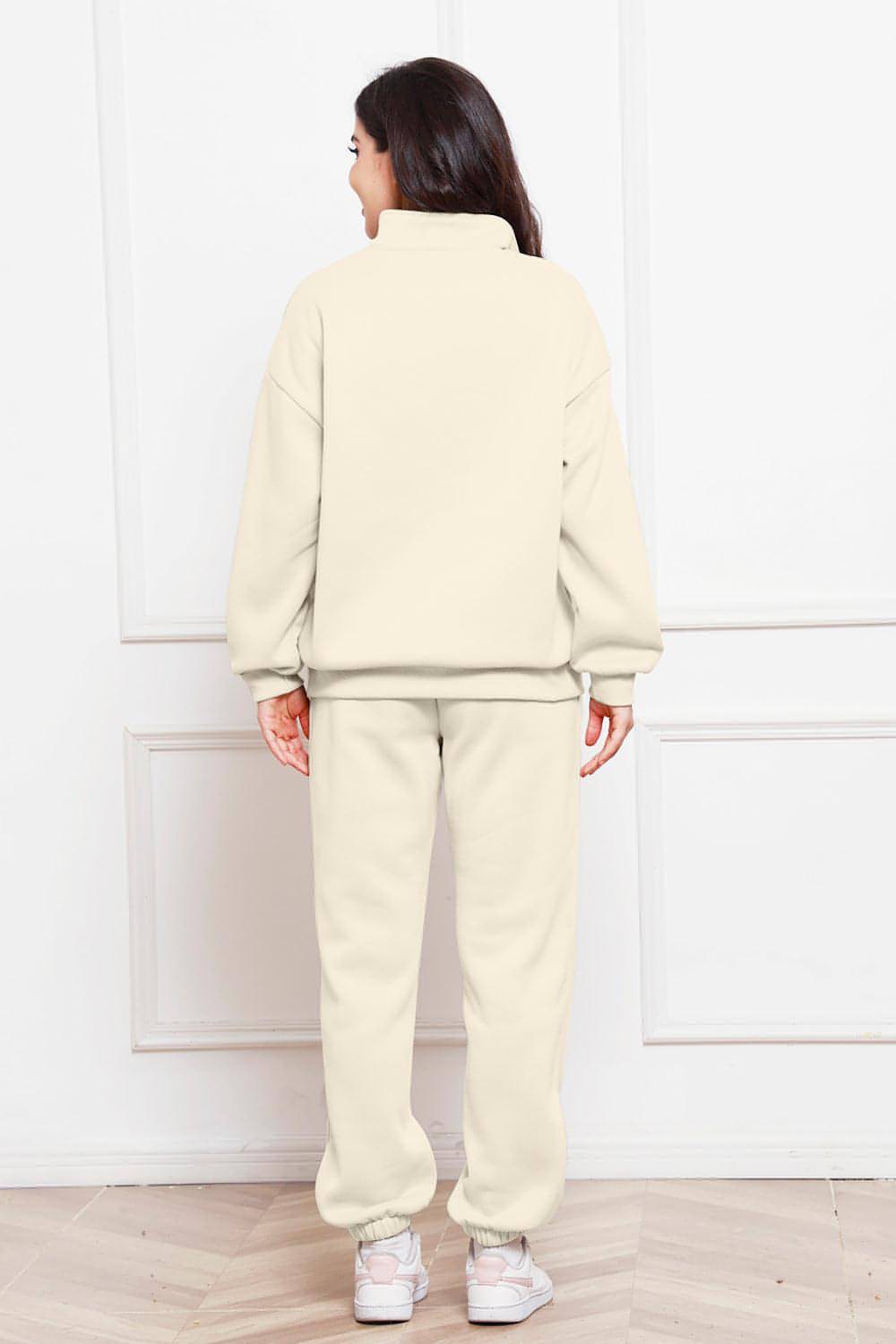 Completo di felpa e pantaloni a maniche lunghe con mezza zip