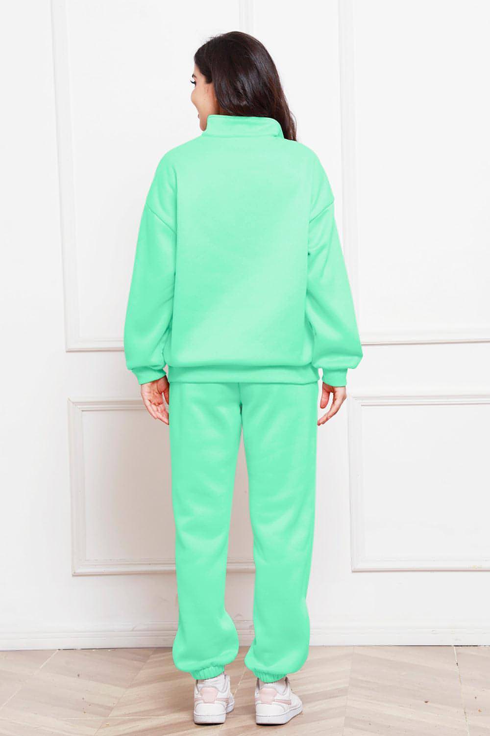 Completo di felpa e pantaloni a maniche lunghe con mezza zip