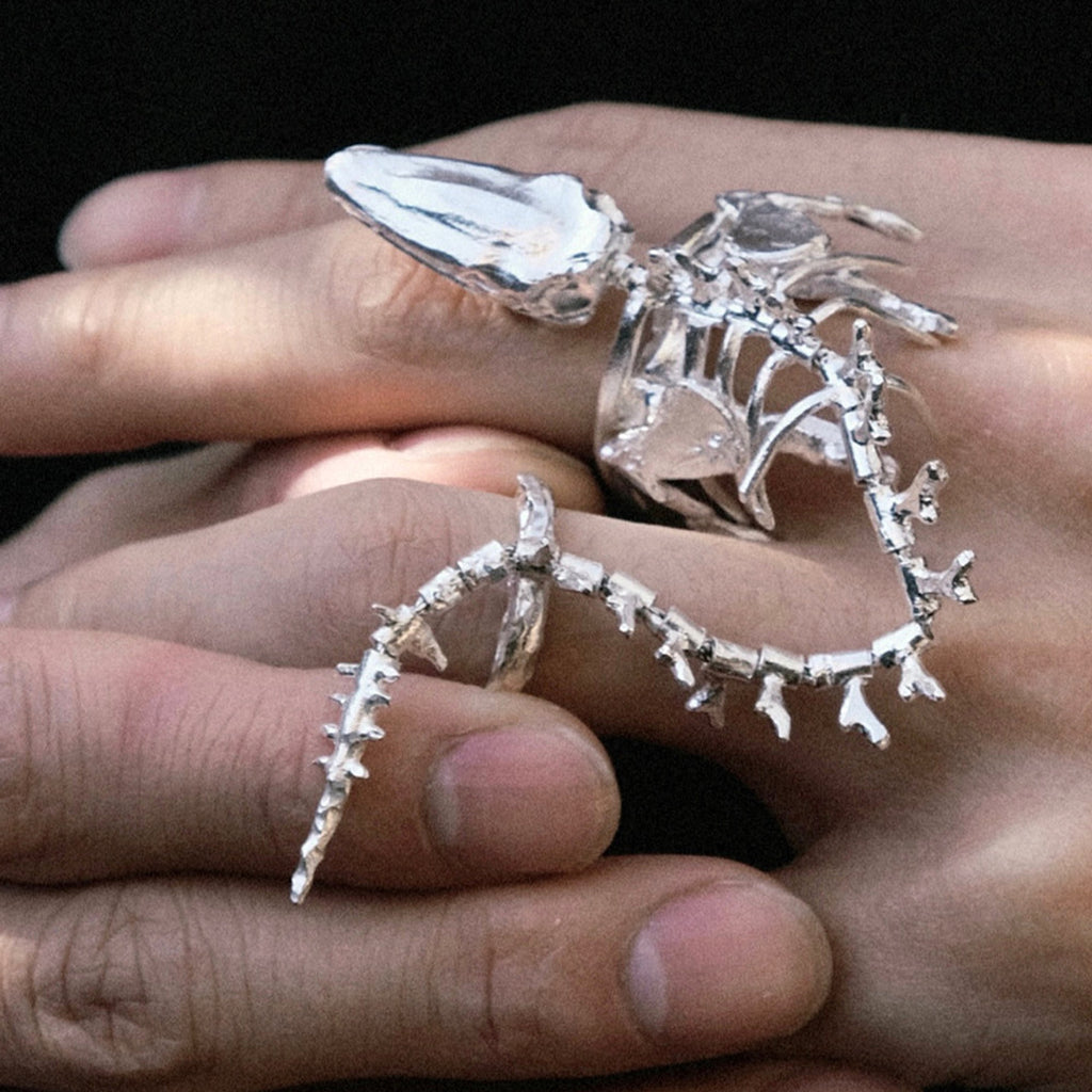Women Wear White And Dark Bone Ring - enhanced image 2