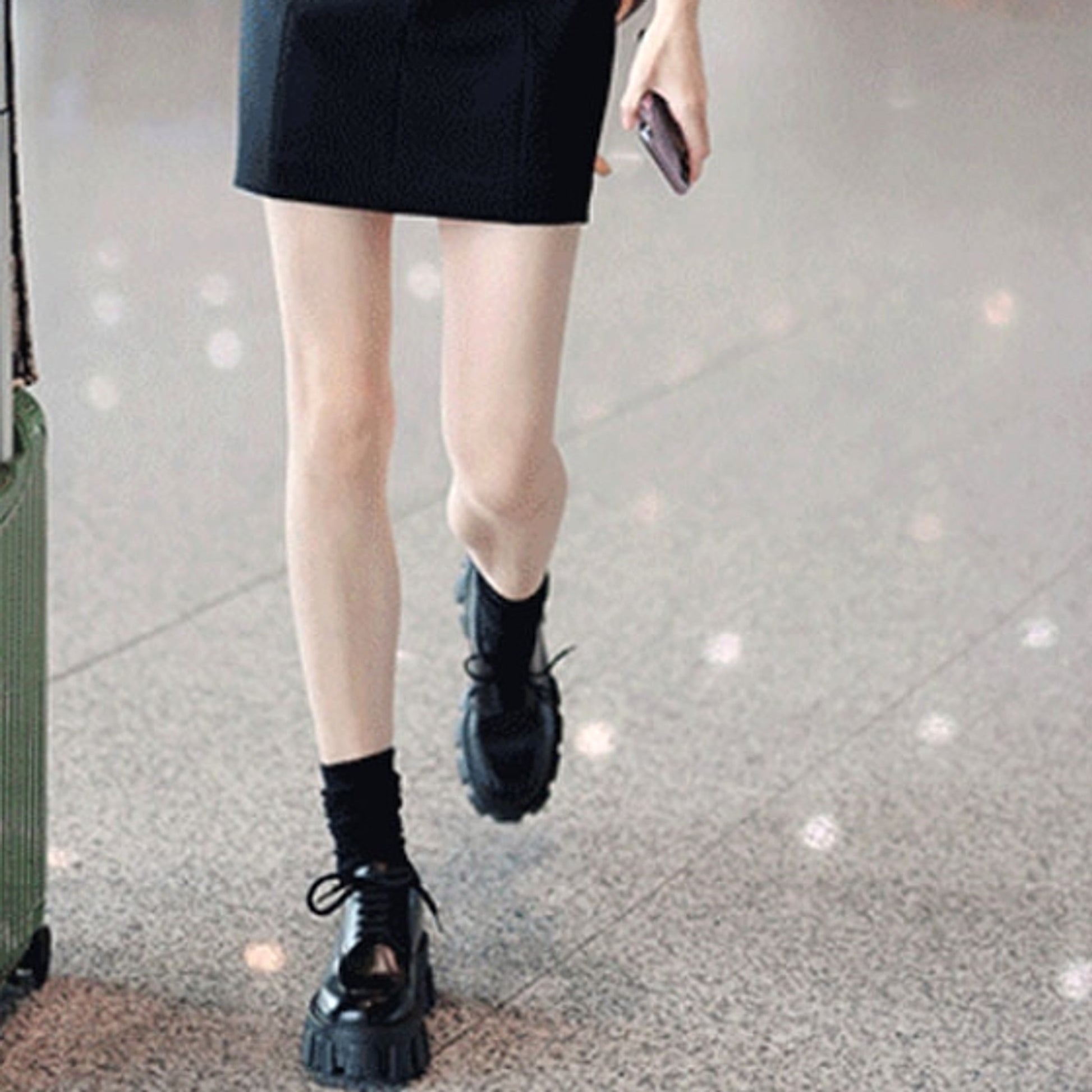 A Woman With A Platform And A Single Shoe - enhanced image 5